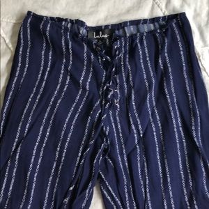 Lulu’s Touch Of Flare Navy Lace Up Flare Pants